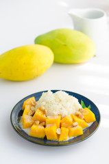 Sweet mango with sticky rice mix with coconut milk