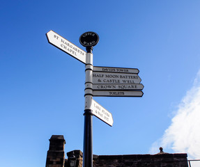 direction sign in Edinburgh castle with blue sky, Scotland, UK