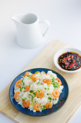 Asian street food. Sticky rice with dry shrimp and onion