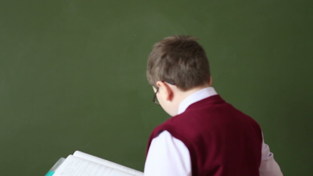 boy washes with the school board and begins to solve example