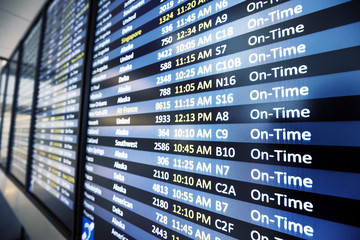 info of flight on billboard in airport