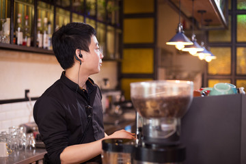 waiter serving in modern cafe