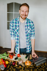 Young man cooking in home kitchen