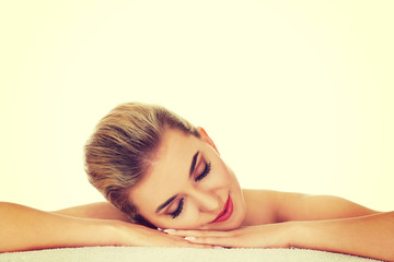 Fototapeta premium Young beautiful woman based on table