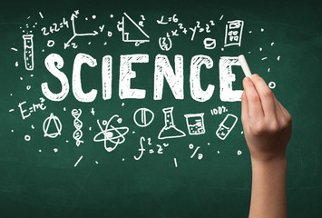 Mature science person drawing on board