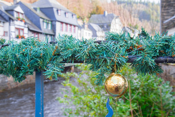 Golden christmas bauble outside