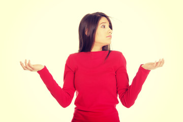 Woman making a scale with her arms.