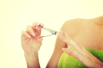 Woman with a nail scissor.