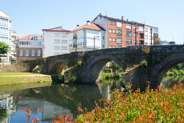 Cabe river and old stone bridge at Monforte de Lemos