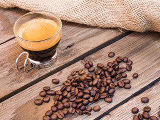 Cup of coffee on aged wooden table