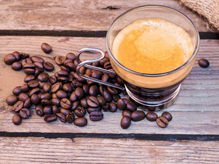 Cup of coffee on aged wooden table