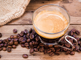 Cup of coffee on aged wooden table