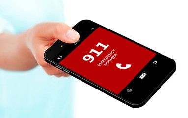 hand holding mobile phone with emergency number 911