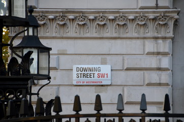 Obraz premium Downing Street's sign in Westminster. Downing St. has housed government leaders for over three hundred years. 