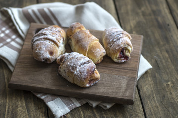 Baked croissants stuffed with jam