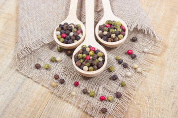 Color pepper on a wooden background.