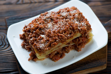 Close-up of traditional italian lasagna bolognese, studio shot