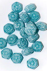 Blue mint candy over white background