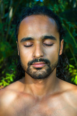 Fototapeta premium Bearded handsome man meditating