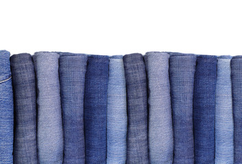 Stack of Blue denim jeans isolated on white background