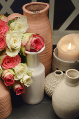 vase with flower and candle light (soft focus,lens blur)