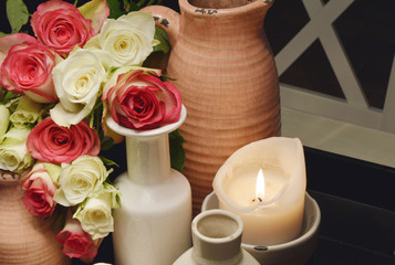 vase with flower and candle light (soft focus,lens blur)