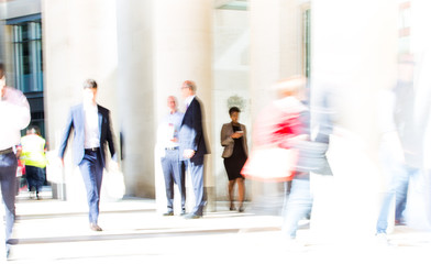 LONDON UK - SEPTEMBER 10, 2015: City of London lunch time. Lots of office people walking on the street. People blur