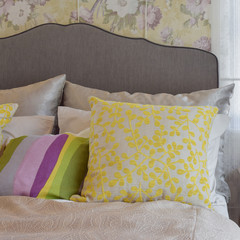 cozy bedroom interior with colorful pillow on bed