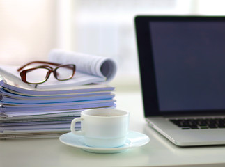 office desk a stack of computer paper reports work forms