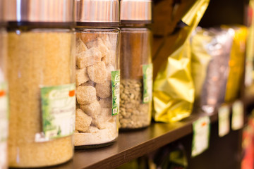Packs of coffee and shugar are on the shelves in store
