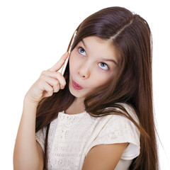 Portrait of brunette Caucasian schoolgirl calling by phone