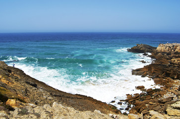 Waves breaking against coast near Sintra, Portugal