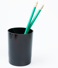 green pencil in the black holder