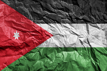 Jordan flag painted on crumpled paper background