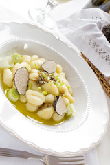 Gnocchi with truffle on white plate