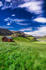 Fototapeta na wymiar Small cottage in the mountains, Iceland