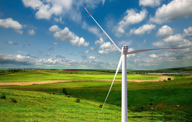 Fototapeta na wymiar Windmills at a field