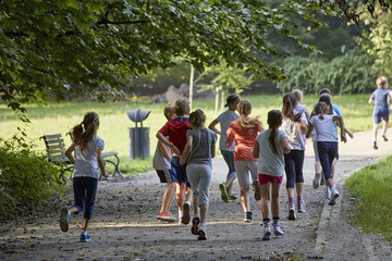 Children running in park