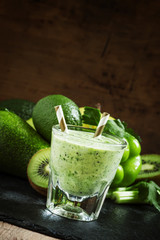 Green detox smoothie with avocado, kiwi, celery, bell peppers