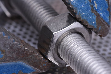 Close up of bolt nut with wrench