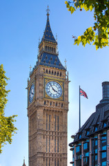 Fototapeta na wymiar LONDON, UK - SEPTEMBER 10, 2015: The Union Flag flying in front of the clock tower Big Ben, Palace of Westminster. London UK