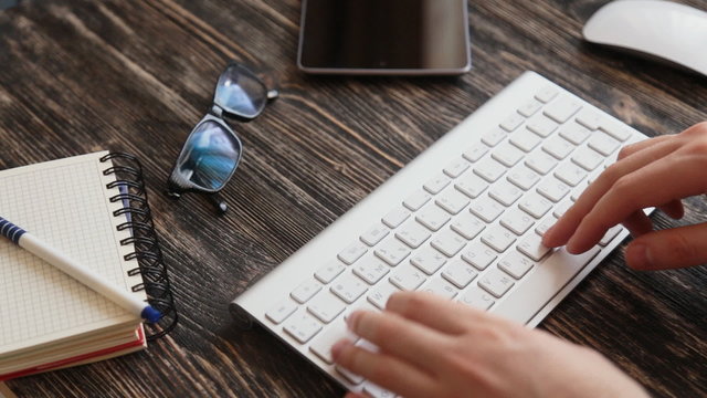 Workplace  glasses and note paper on wooden table