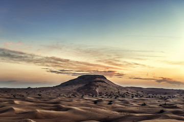 Fototapeta na wymiar Colorful red sunset over desert