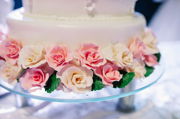 wedding cake decorated with roses