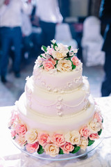 wedding cake decorated with roses