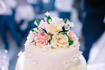 wedding cake decorated with roses