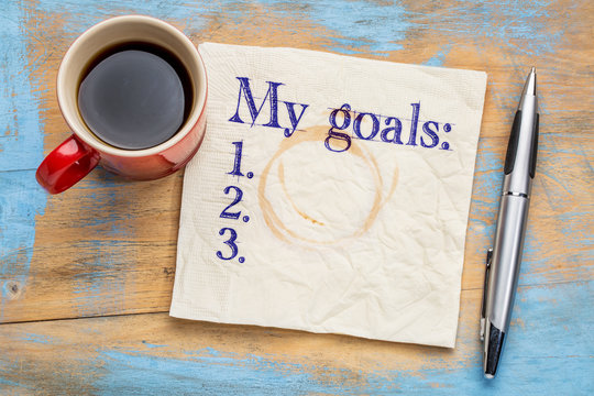 my goals list on napkin and coffee