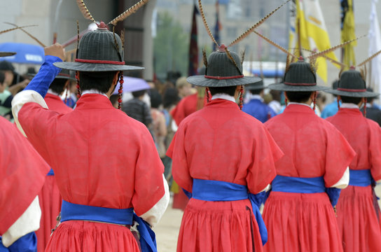 Row of armed guards in ancient traditional soldier uniforms in the old royal residence, Seoul, South Korea..