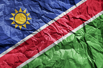 Namibia flag painted on crumpled paper background