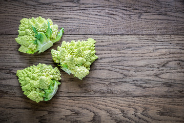 Fresh romanesco broccoli on the wooden board